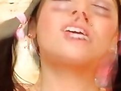 Pig tailed German teen girl gets her wide mouth sprayed with cum